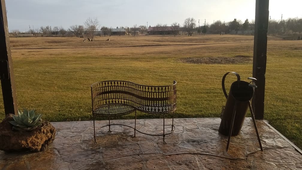 sitting area by little putting course at Gage Gardens